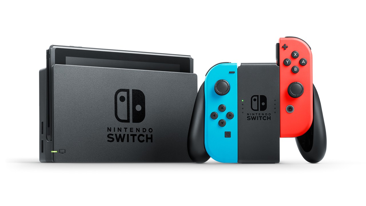 Original Nintendo Switch console, dock and Joy-Con controllers on a white background